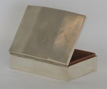 A large engine turned cigarette case with hinged t