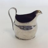 EXETER: A Georgian helmet shaped cream jug on reed