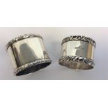 Two heavy silver embossed napkin rings. Various da