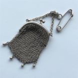 A small silver mesh purse on suspension chain. App