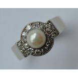 An attractive high carat pearl and diamond cluster