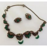 A gilt gem set necklace together with matching ear
