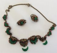 A gilt gem set necklace together with matching ear