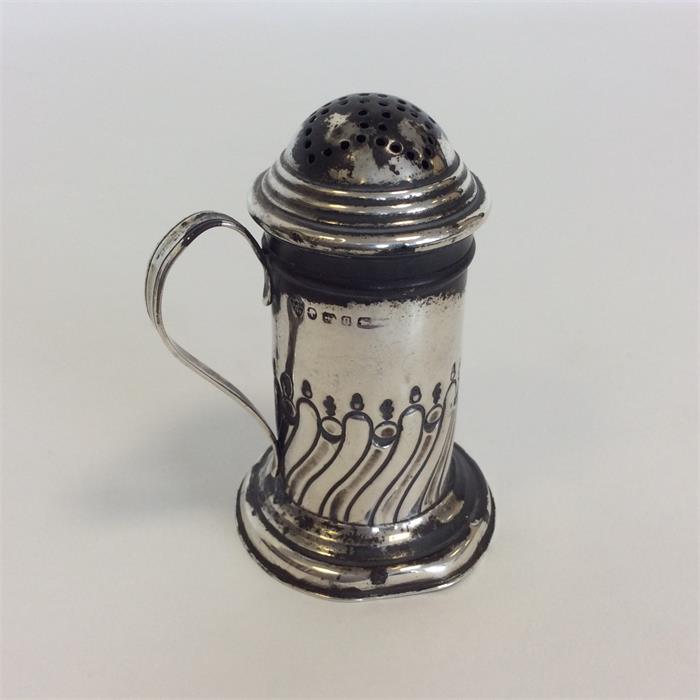 A Victorian silver half fluted dredger on pedestal