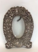 A heavy large embossed picture frame decorated wit