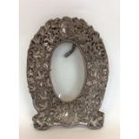 A heavy large embossed picture frame decorated wit