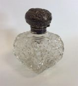A large square hobnail cut scent bottle with embos