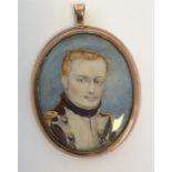 A good portrait miniature of a gent in oval gold f