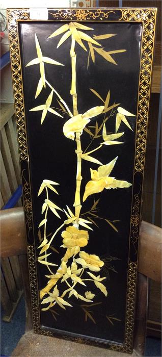 A rectangular lacquered panel.