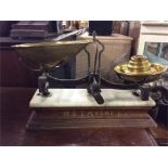 A good set of brass and marble mounted scales and