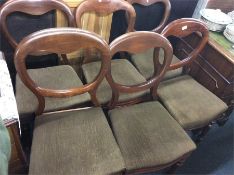 A set of six mahogany hoop backed chairs.