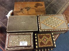 A shagreen box together with other inlaid caddies.