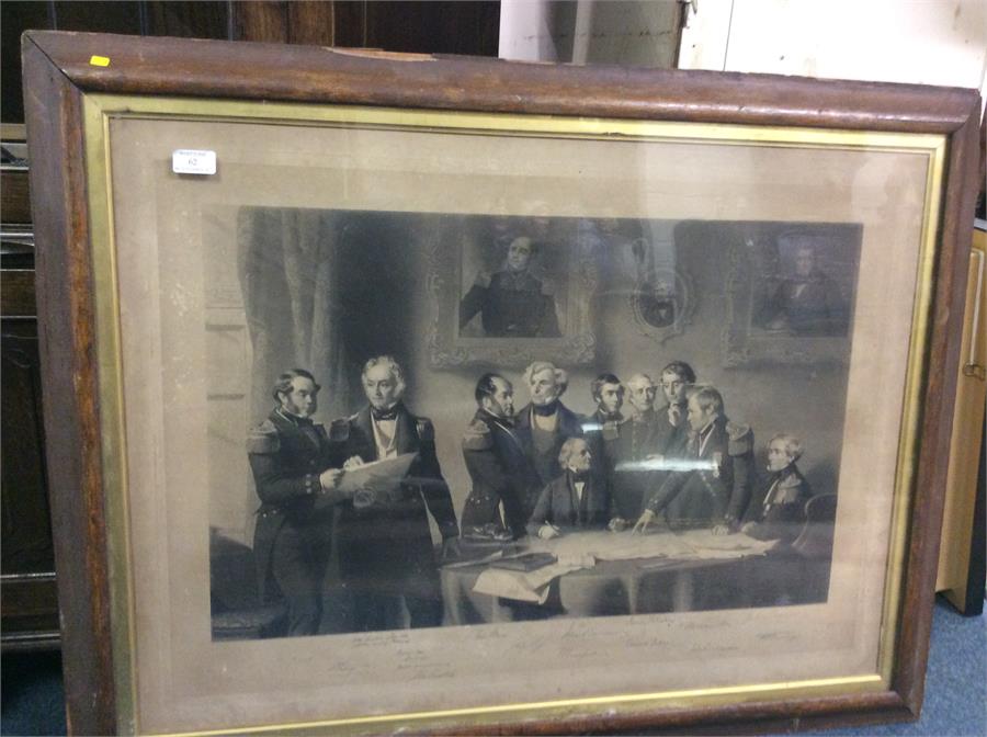 A large rosewood framed print.