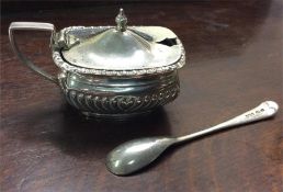 A silver half fluted mustard pot together with spo