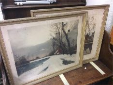 A pair of framed and glazed Winter pictures.