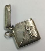 A silver hinged top vesta case decorated with a go