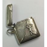 A silver hinged top vesta case decorated with a go