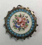 An attractively enamelled circular brooch in silve