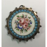 An attractively enamelled circular brooch in silve