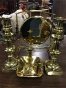 A large pair of brass candlesticks together with a
