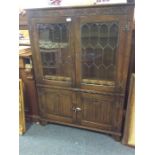 A lead glazed oak bookcase.