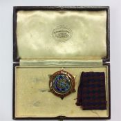 A silver and enamel Masonic pendant.