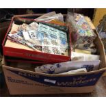 A large box containing stamps and stamp albums.