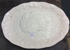 A large pottery turkey plate.