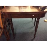 A mahogany tilt top card table.