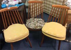 A set of three Ercol chairs.