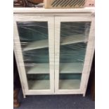 A painted two door glazed cabinet.