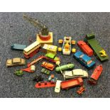 A box containing a DInky race car, bus etc. Est. £