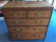 A large mahogany chest of three long and two short