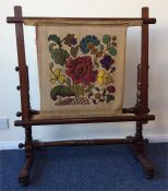 A mahogany tapestry frame on turned support. Est.