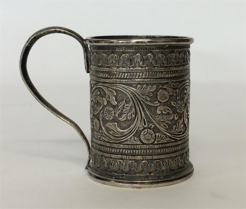 An Indian christening cup attractively decorated w