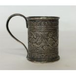 An Indian christening cup attractively decorated w