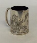 A small silver tapering christening cup engraved w