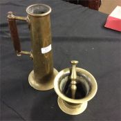 An unusual brass jug with turned wooden handle tog