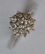 An 18 carat white gold cluster ring. Est. £200 - £