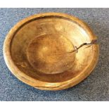 A large wooden rustic bowl. Est. £50 - £80.