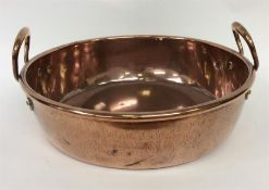 A large copper two-handled preserve bowl. Est. £20