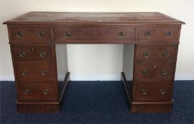 A Victorian mahogany twin pedestal desk with leath