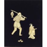 A small ivory mounted wall plaque depicting fisher