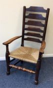 An Antique oak cane seated carver chair. Est. £30