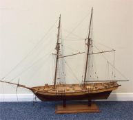 A large handmade boxwood model of a galleon in ope