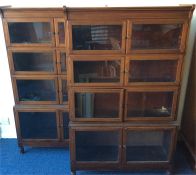 A pair of mahogany eight door sectional stacking b