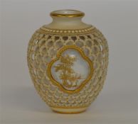 ROYAL WORCESTER: A small vase with pierced decorat