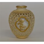 ROYAL WORCESTER: A small vase with pierced decorat