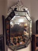 An etched glass mirror with floral cornice. Approx