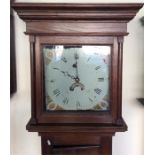 An oak cased grandfather clock with painted dial a